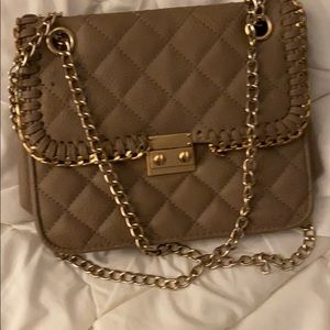 Handbag with gold straps